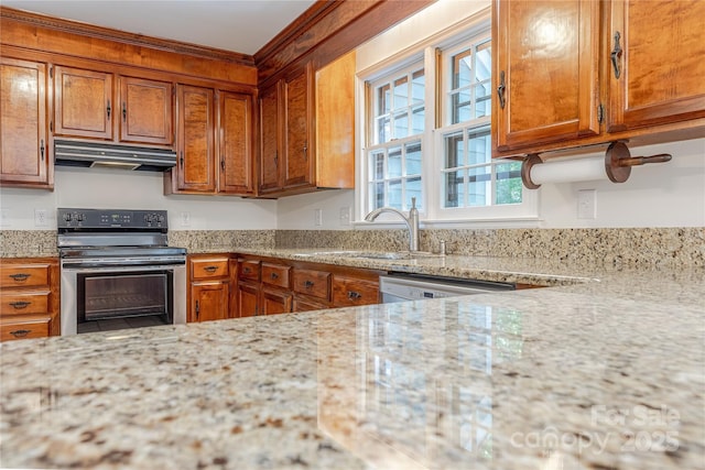 2310 Vestry Pl, Charlotte, NC 28270 - kitchen with stainless steel electric range, under cabinet range hood, a sink, and brown cabinets