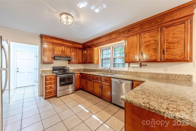 2310 Vestry Pl, Charlotte, NC 28270 - kitchen featuring stainless steel appliances, a sink, brown cabinetry, under cabinet range hood, and light tile patterned floors