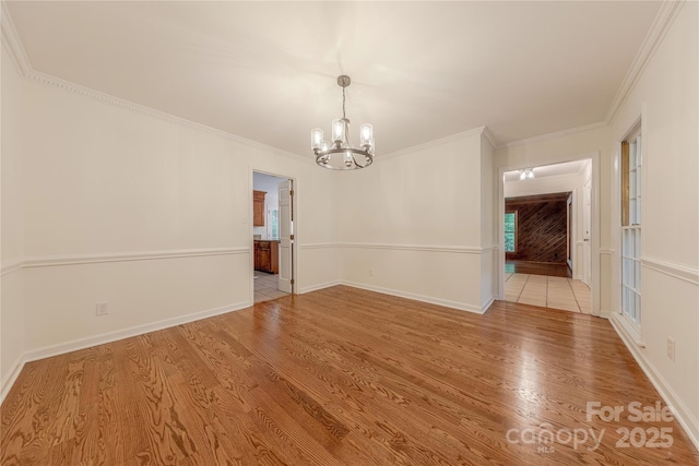 2310 Vestry Pl, Charlotte, NC 28270 - unfurnished dining area featuring a chandelier, wood finished floors, crown molding, and baseboards