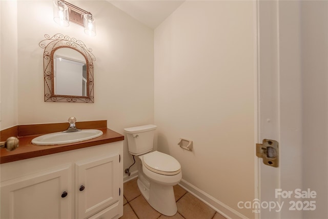 2310 Vestry Pl, Charlotte, NC 28270 - half bath featuring tile patterned flooring, toilet, vanity, and baseboards