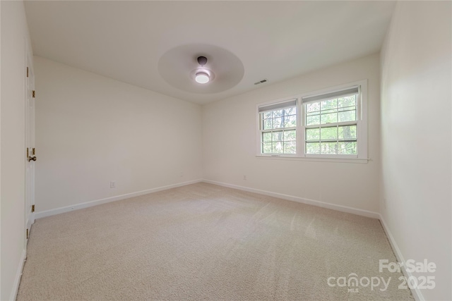 2310 Vestry Pl, Charlotte, NC 28270 - spare room featuring a ceiling fan, light colored carpet, and baseboards