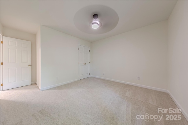 2310 Vestry Pl, Charlotte, NC 28270 - empty room featuring light colored carpet, baseboards, and a ceiling fan