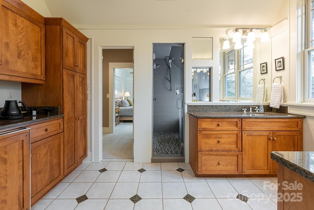 full bath featuring a stall shower, tile patterned flooring, ensuite bath, and vanity