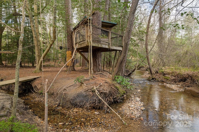 view of jungle gym with a wooden deck