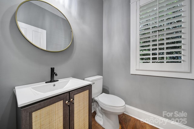5633 Open Book Ln, Charlotte, NC 28270 - bathroom with toilet, wood finished floors, vanity, and baseboards