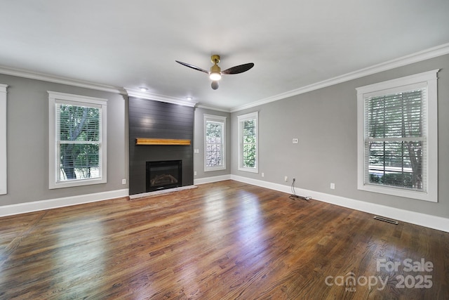 5633 Open Book Ln, Charlotte, NC 28270 - unfurnished living room with plenty of natural light, ceiling fan, ornamental molding, baseboards, and a large fireplace