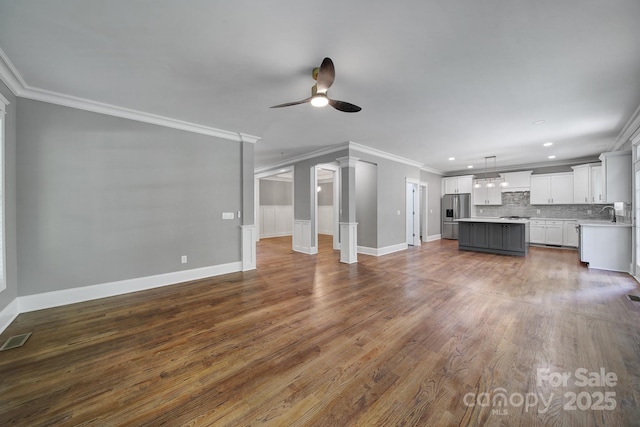 5633 Open Book Ln, Charlotte, NC 28270 - unfurnished living room featuring ornamental molding, a ceiling fan, dark wood-type flooring, baseboards, and recessed lighting