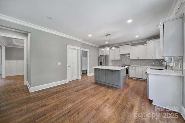 5633 Open Book Ln, Charlotte, NC 28270 - kitchen featuring stainless steel appliances, a sink, light countertops, a kitchen island, and tasteful backsplash