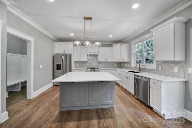 5633 Open Book Ln, Charlotte, NC 28270 - kitchen with stainless steel appliances, a sink, ornamental molding, a center island, and white cabinets