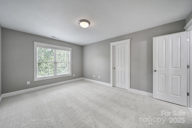5633 Open Book Ln, Charlotte, NC 28270 - unfurnished bedroom featuring carpet and baseboards