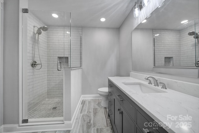 5633 Open Book Ln, Charlotte, NC 28270 - bathroom featuring baseboards, a shower stall, vanity, toilet, and recessed lighting
