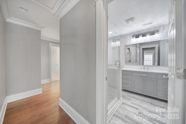 5633 Open Book Ln, Charlotte, NC 28270 - full bath with ornamental molding, a shower stall, vanity, baseboards, and wood finished floors