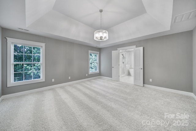 5633 Open Book Ln, Charlotte, NC 28270 - unfurnished bedroom with a raised ceiling, carpet flooring, a chandelier, and baseboards