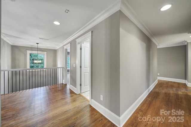 5633 Open Book Ln, Charlotte, NC 28270 - hallway featuring wood finished floors, baseboards, ornamental molding, and recessed lighting