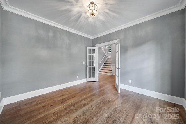 5633 Open Book Ln, Charlotte, NC 28270 - unfurnished room featuring stairs, a chandelier, wood finished floors, crown molding, and baseboards