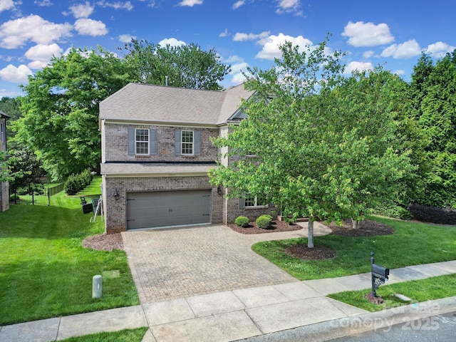 5633 Open Book Ln, Charlotte, NC 28270 - view of front of home with brick siding, driveway, a front lawn, and a garage