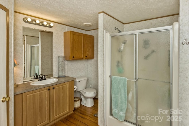 20 Howell Rd, Brevard, NC 28712 - bathroom featuring a textured ceiling, wood finished floors, vanity, a shower with door, and toilet