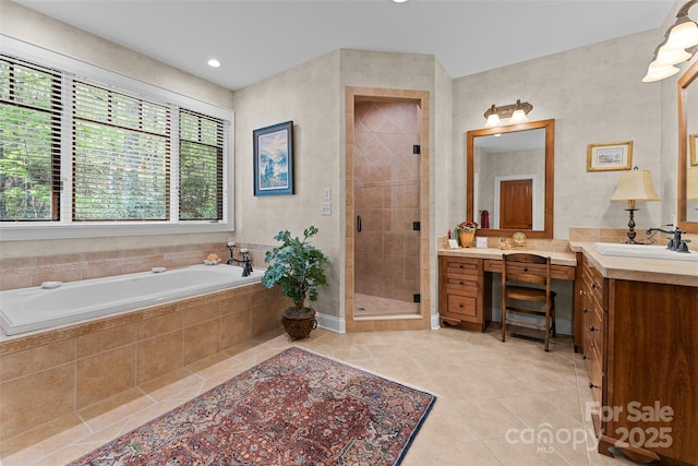 bathroom with tile patterned floors, a shower stall, a bath, and vanity