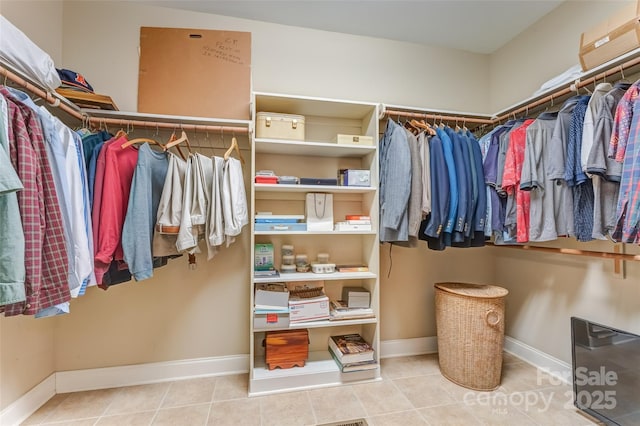 spacious closet featuring tile patterned floors