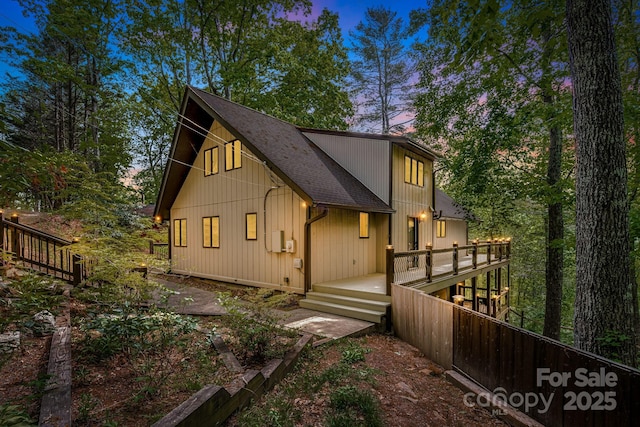 8 Quinn Ct, Asheville, NC 28805 - rear view of house with roof with shingles and a deck