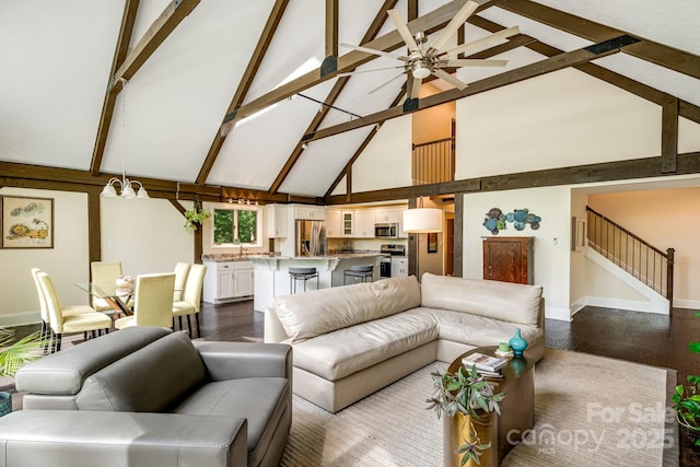 8 Quinn Ct, Asheville, NC 28805 - living area featuring high vaulted ceiling, baseboards, stairs, dark wood finished floors, and a ceiling fan