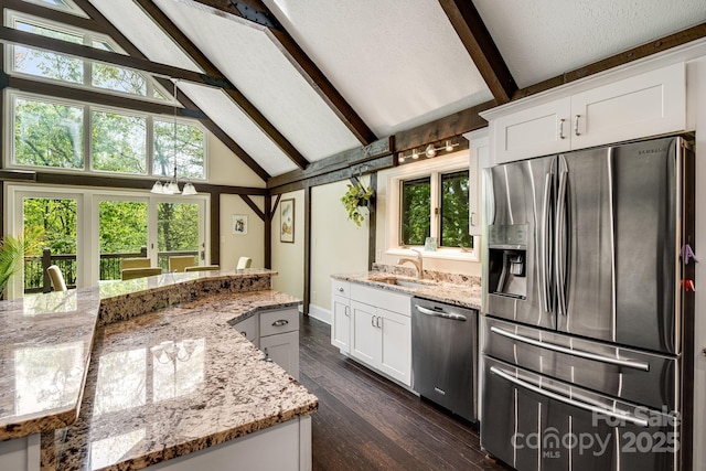 8 Quinn Ct, Asheville, NC 28805 - kitchen with stainless steel appliances, beam ceiling, a sink, high vaulted ceiling, and white cabinetry