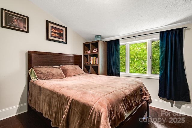 8 Quinn Ct, Asheville, NC 28805 - bedroom with lofted ceiling, baseboards, a textured ceiling, and wood finished floors