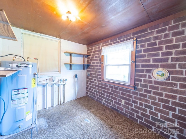 basement featuring carpet flooring, water heater, wood ceiling, and brick wall