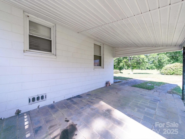 view of patio / terrace with a carport