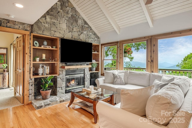 61 Ivy Ridge Rd, Burnsville, NC 28714 - living area with hardwood / wood-style flooring, a stone fireplace, and wooden ceiling