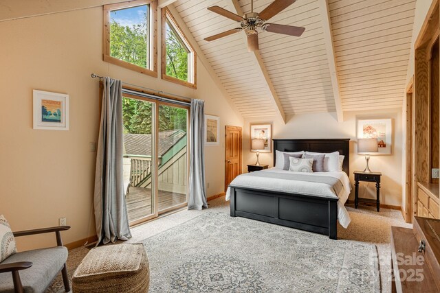 61 Ivy Ridge Rd, Burnsville, NC 28714 - carpeted bedroom featuring access to exterior, baseboards, wooden ceiling with exposed beams, a ceiling fan, and high vaulted ceiling