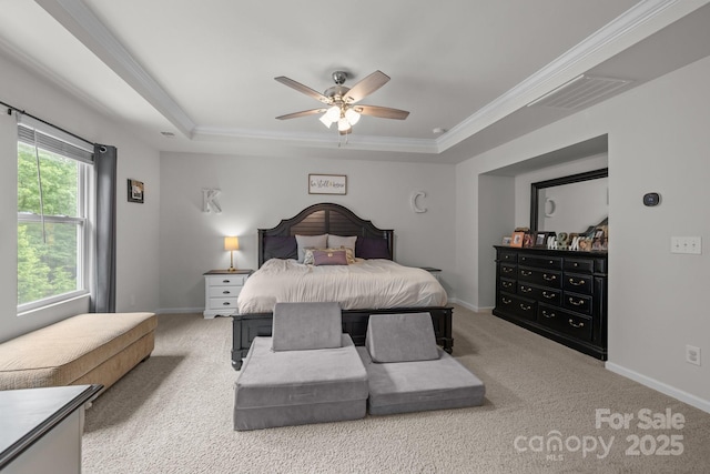 bedroom with a raised ceiling, light carpet, baseboards, crown molding, and a ceiling fan