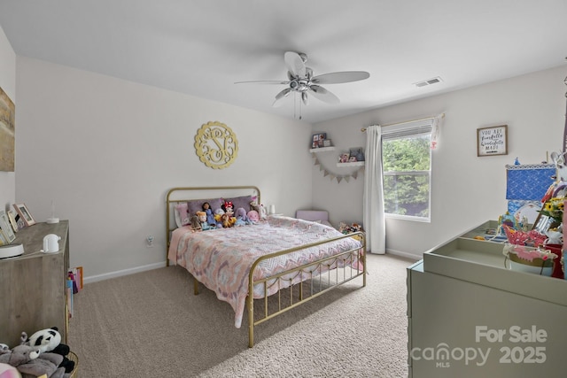 carpeted bedroom with baseboards and a ceiling fan