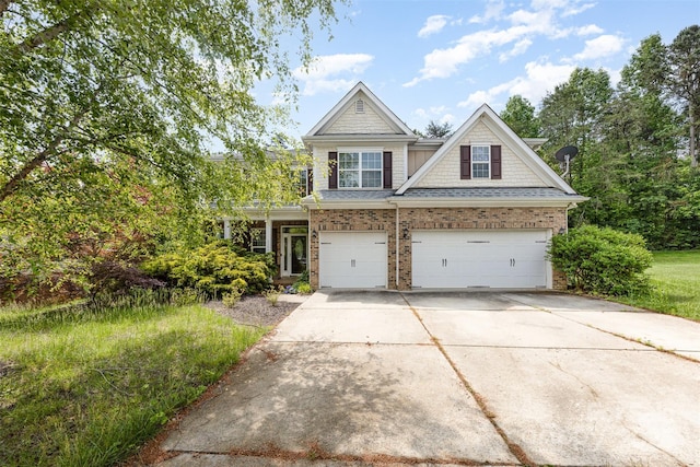 4504 Rockland Ct, High Point, NC 27265 - view of front of home with driveway, brick siding, and a garage