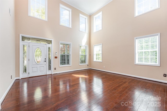 4504 Rockland Ct, High Point, NC 27265 - entryway featuring a towering ceiling, wood-type flooring, baseboards, and crown molding