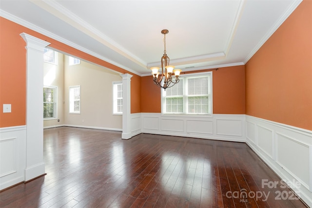 4504 Rockland Ct, High Point, NC 27265 - spare room with a chandelier, wainscoting, a tray ceiling, crown molding, and decorative columns