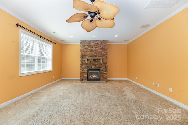 4504 Rockland Ct, High Point, NC 27265 - unfurnished living room with ornamental molding, a ceiling fan, carpet floors, a stone fireplace, and baseboards