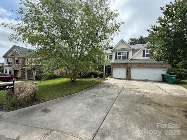 4504 Rockland Ct, High Point, NC 27265 - craftsman house with concrete driveway, a front yard, brick siding, and an attached garage