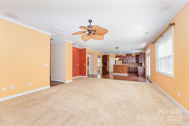 4504 Rockland Ct, High Point, NC 27265 - unfurnished living room featuring dark carpet, ceiling fan, ornamental molding, and recessed lighting