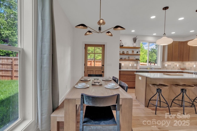 30 Spaulding Dr, Candler, NC 28715 - dining space featuring light wood finished floors, recessed lighting, and a chandelier