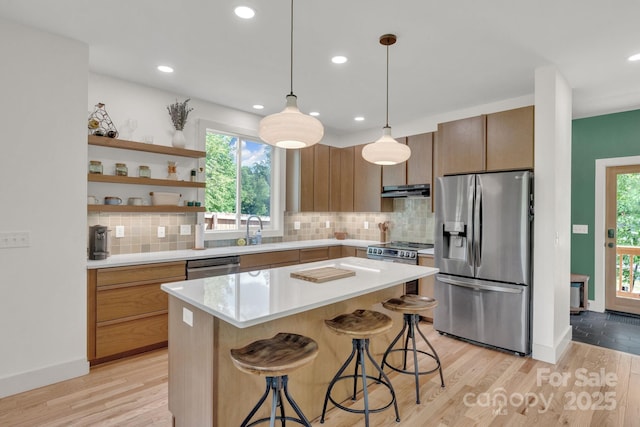 30 Spaulding Dr, Candler, NC 28715 - kitchen featuring stainless steel appliances, a kitchen bar, healthy amount of natural light, light countertops, and recessed lighting