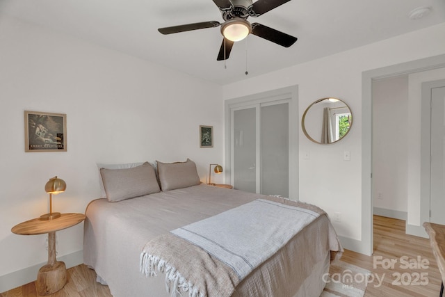 30 Spaulding Dr, Candler, NC 28715 - bedroom with light wood-type flooring, baseboards, and a ceiling fan
