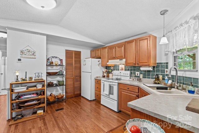 3755 River Rd, Richfield, NC 28137 - kitchen with white appliances, under cabinet range hood, a sink, vaulted ceiling, and light wood finished floors