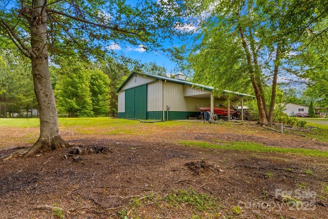 3755 River Rd, Richfield, NC 28137 - view of side of property featuring a chimney, an outbuilding, an attached carport, and an outdoor structure