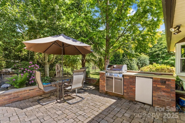 3755 River Rd, Richfield, NC 28137 - view of patio featuring area for grilling, outdoor dining space, and view of wooded area