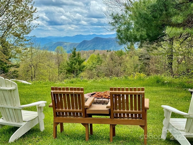 exterior space featuring a wooded view