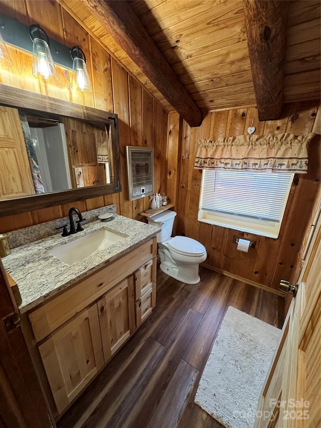 bathroom with wooden ceiling, toilet, wooden walls, and wood finished floors