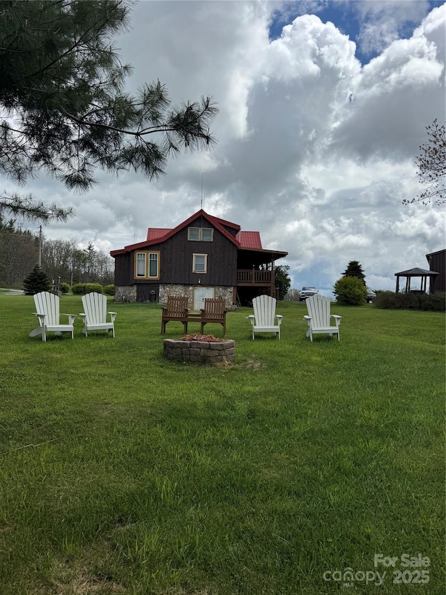 7348 Joe Johnson St, Newland, NC 28657 - rear view of property with a lawn