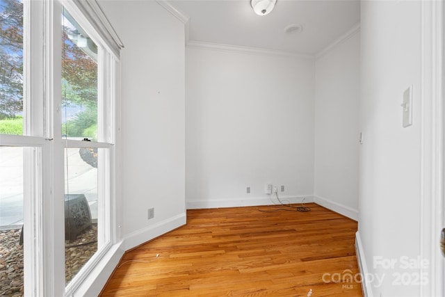 16108 Woolwine Rd, Charlotte, NC 28278 - empty room with ornamental molding, light wood-type flooring, and baseboards