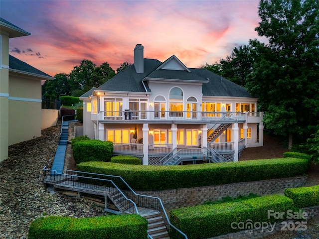 16108 Woolwine Rd, Charlotte, NC 28278 - back of property featuring stairs, a chimney, a balcony, and roof with shingles